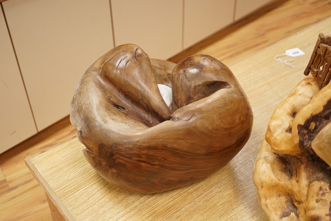 Pierre Decorse (b.1953), a naturalistically modelled wooden sculpture with inset stone, 37cm wide